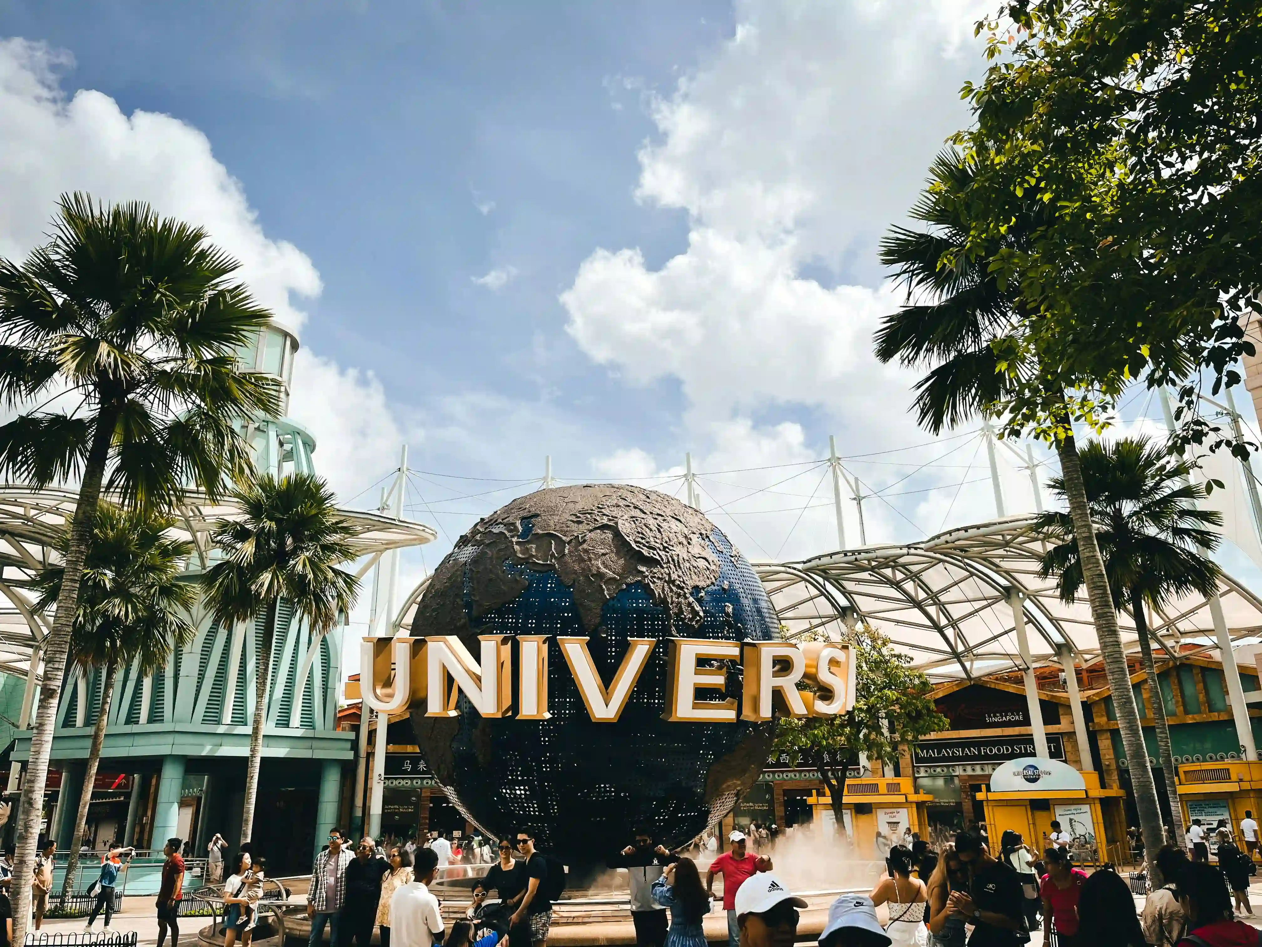 a-group-of-people-standing-in-front-of-universal
